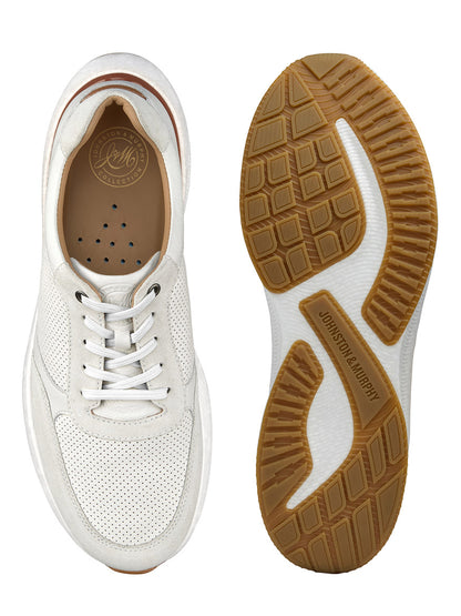 J & M Collection Briley Perfed Jogger in Ivory Full Grain. These sneakers showcase a perforated design and are complemented by a brown rubber sole. Enhanced with a memory-foam footbed for added comfort. Top view on the left; bottom view on the right.