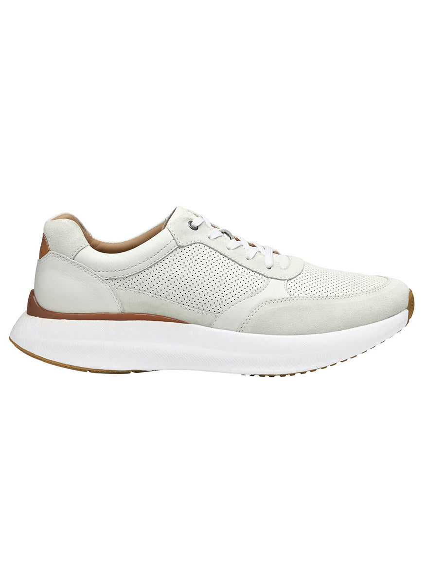 The J & M Collection Briley Perfed Jogger in Ivory Full Grain showcases a perforated full grain leather upper, a POWERFOAM midsole, and a white sole with a brown accent on the heel, viewed from the side.