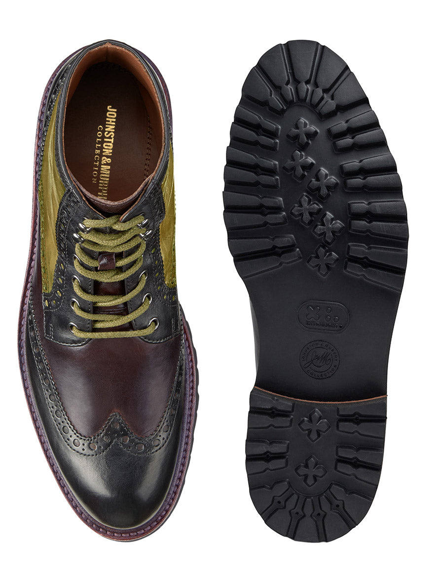 J & M Collection Dudley Lug Wingtip Boot in Black Multi Calfskin by Johnston & Murphy, featuring one boot with a polished upper section in black, brown, and green, and the other showcasing a rugged black sole with a durable EVA outsole.