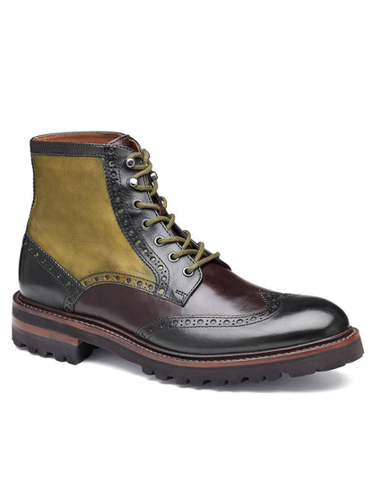 Introducing the J & M Collection Dudley Lug Wingtip Boot in Black Multi Calfskin from Johnston & Murphy, boasting a sophisticated combination of olive green and dark brown leather with intricate brogue detailing. This stylish boot features distinctive green laces, a rugged EVA outsole, and is constructed with a Goodyear welt for enhanced durability.