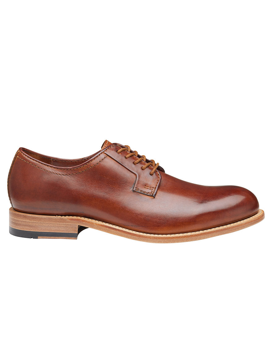 A single J & M Collection Dudley Plain Toe in Tan Dip-Dyed Calfskin with laces on a white background.