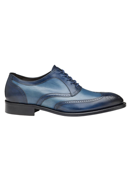 J & M Collection Ellsworth Wingtip in Navy Italian Calfskin oxford shoe with brogue details on a white background.