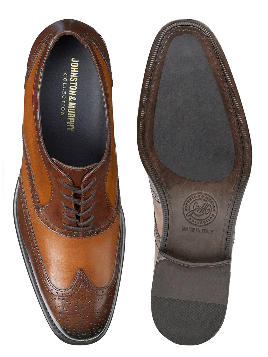 Top view of a pair of brown J & M Collection Ellsworth Wingtip in Tan Italian Calfskin dress shoes with brogue detailing.