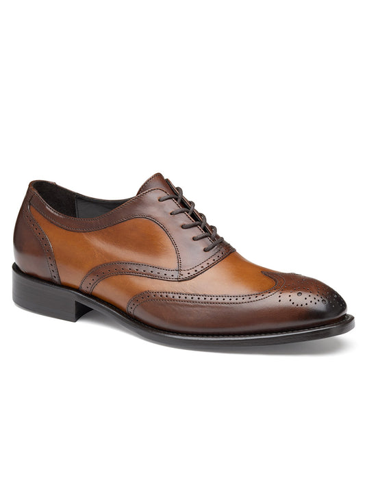 A single brown J & M Collection Ellsworth Wingtip in Tan Italian Calfskin shoe with decorative perforations on a white background.