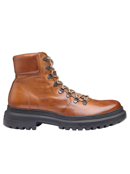 The J & M Collection Everson Alpine Boot in Tan Italian Calfskin is a handcrafted boot featuring a cushioned footbed, black rubber sole, and metal eyelets.