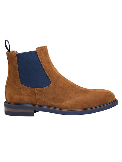 J & M Collection Hartley Chelsea Boot in Snuff Italian Suede with blue elastic side panels and a pull tab, featuring a low heel, a dark blue sole, and a leather-covered footbed.