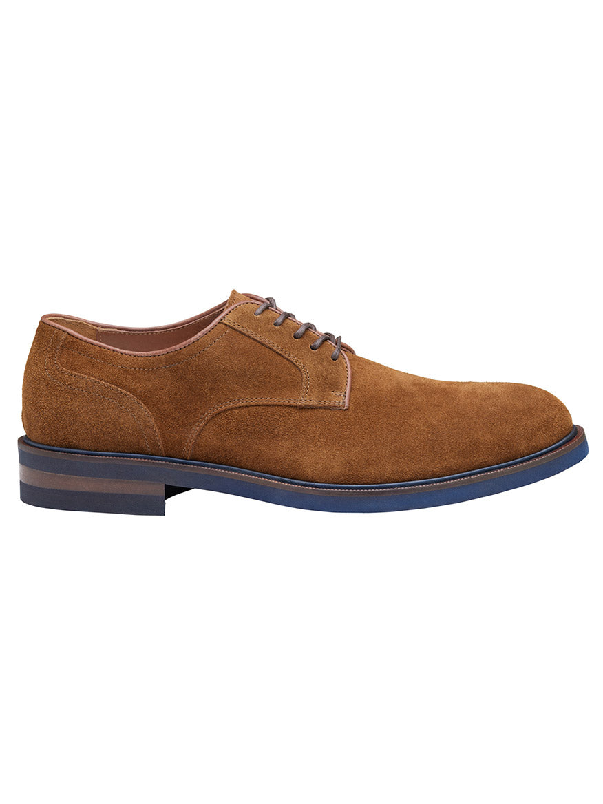 The J & M Collection Hartley Plain Toe in Snuff Italian Suede features a brown Italian suede exterior, complemented by blue soles, a dark brown layered heel, laces, a classic design, and a comfortable leather lining.