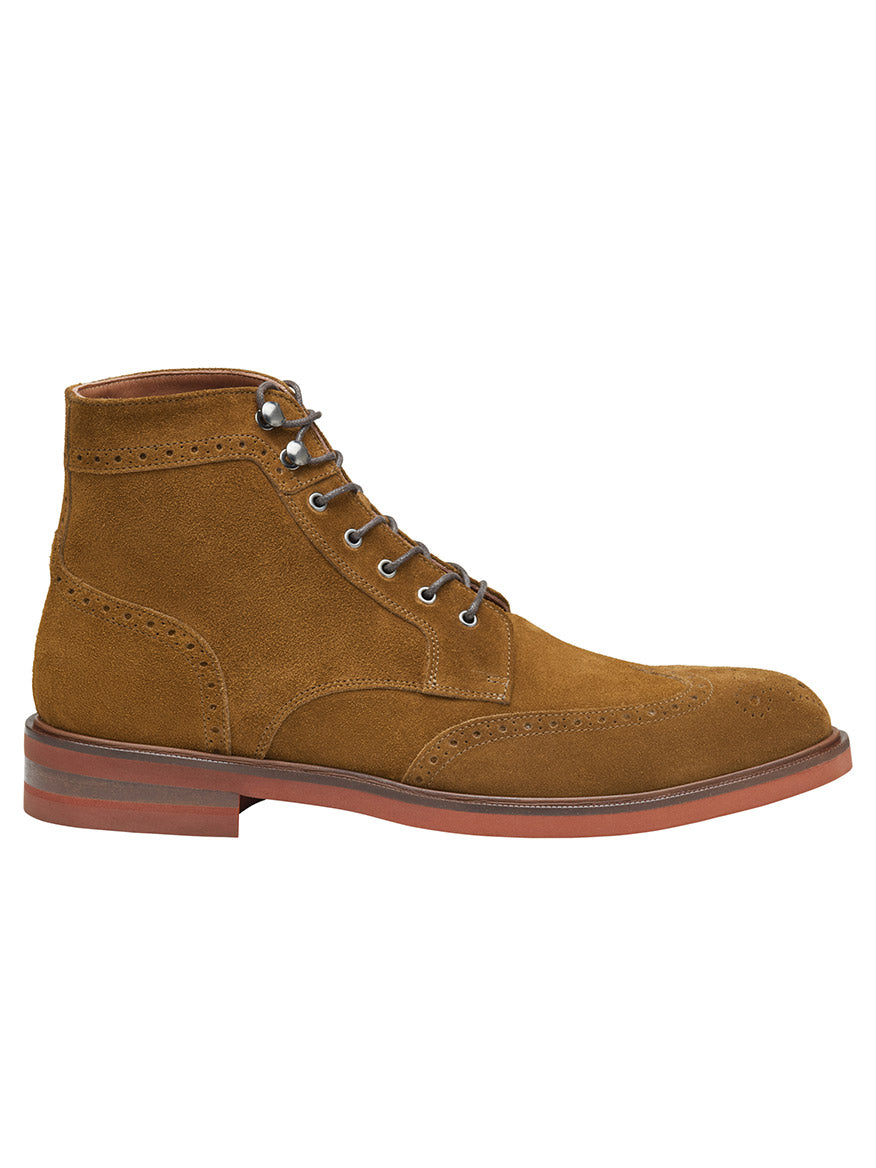 The J & M Collection Hartley Wingtip Boot in Snuff Italian Suede features decorative perforations, a round toe, and a red-brown sole, complemented by a durable Vibram EVA outsole.