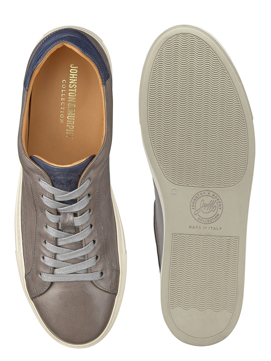 A pair of J & M Collection Jared Lace-To-Toe in Grey Italian Calfskin with leather lining and laces, one showing the top view and the other displaying the sole.