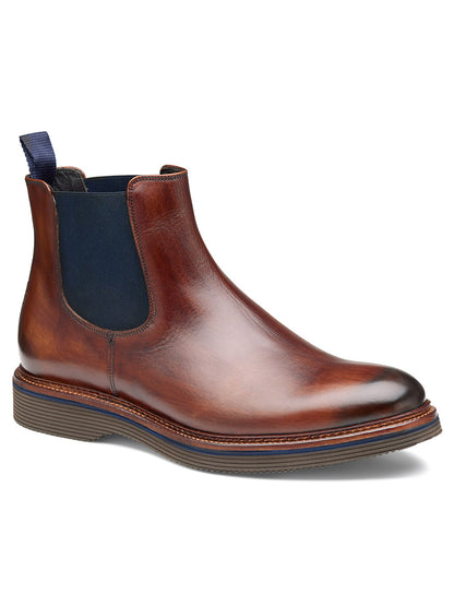 The J & M Collection Jenson Chelsea Boot in Brown Hand-Stained Calfskin features a polished European calfskin upper, dark elastic side panel, pull tab at the back, and an XL EXTRALIGHT outsole.