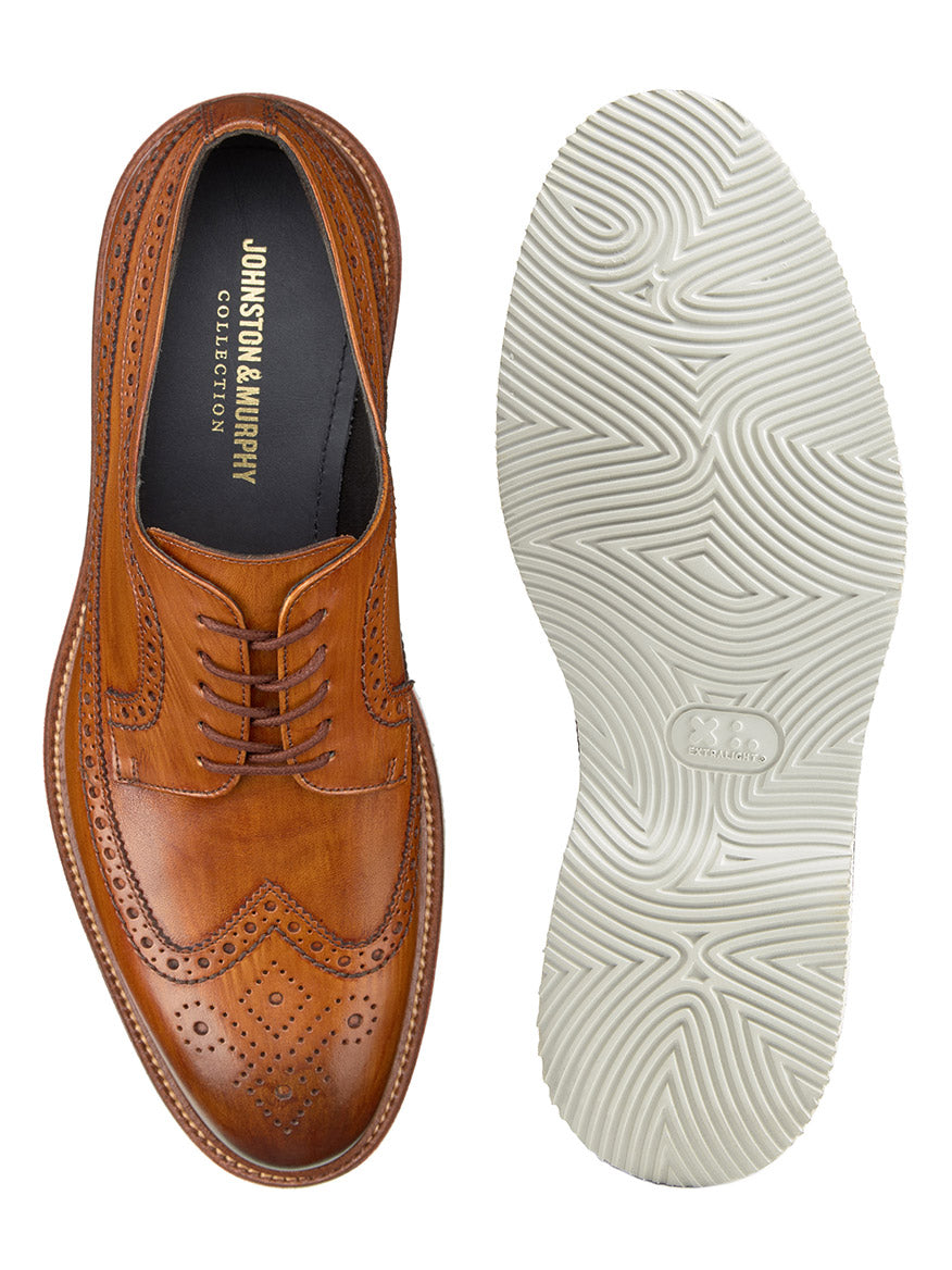 Pair of J & M Collection Jenson Longwing in tan Italian calfskin from Johnston & Murphy, shown from the top and bottom, with intricate perforations and white rubber soles. Features hand-stained calfskin uppers and a cushioned leather-covered footbed.