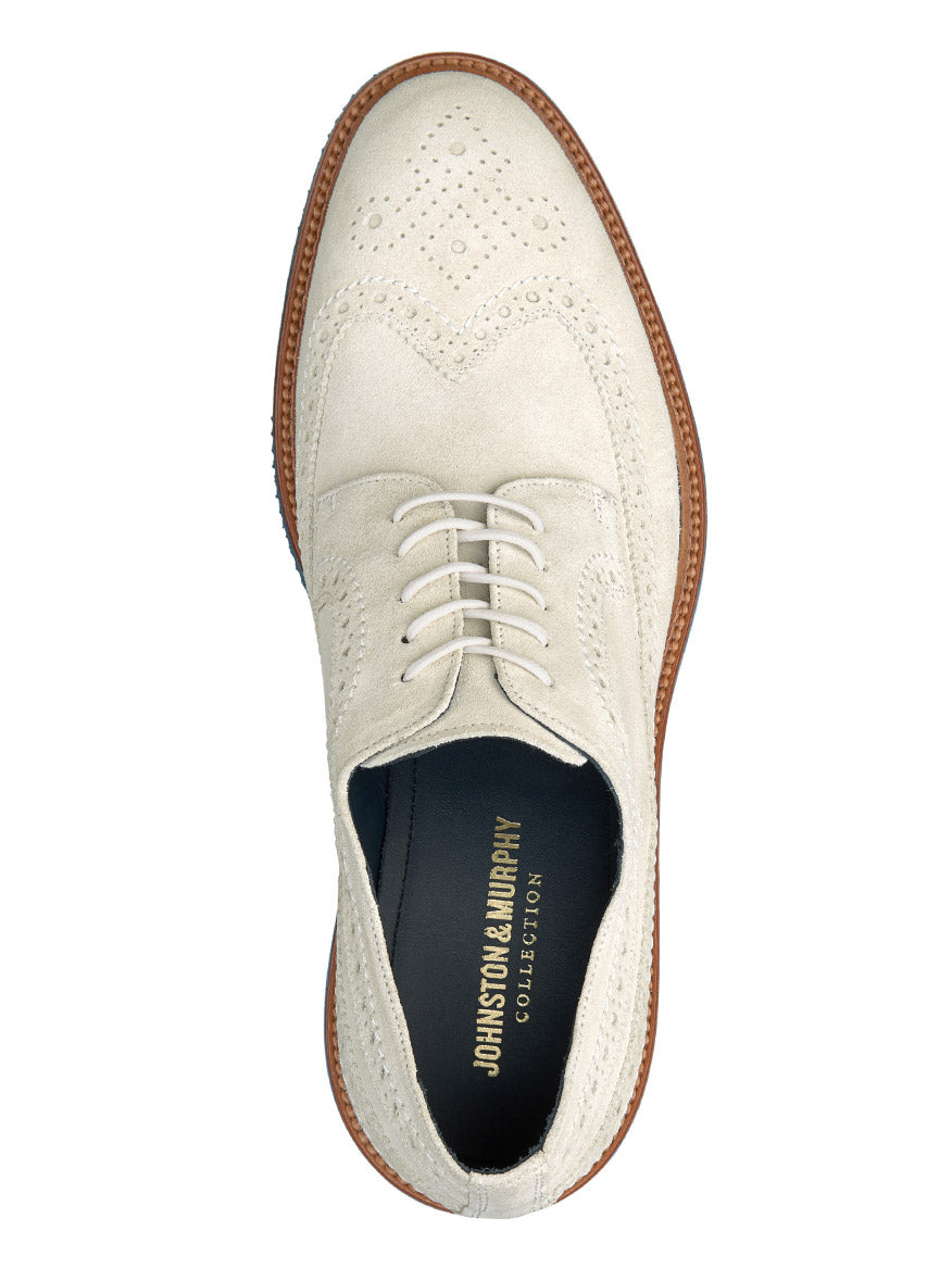 A single J & M Collection Jenson Longwing in Off-White Italian Suede brogue shoe with laces, viewed from above.