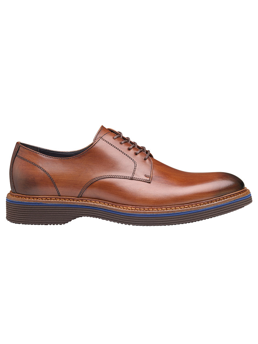 The J & M Collection Jenson Plain Toe in Brown Italian Calfskin is a leather Oxford shoe, highlighted by its European calfskin material, lace-up design, and dark EVA outsole, viewed from the side.