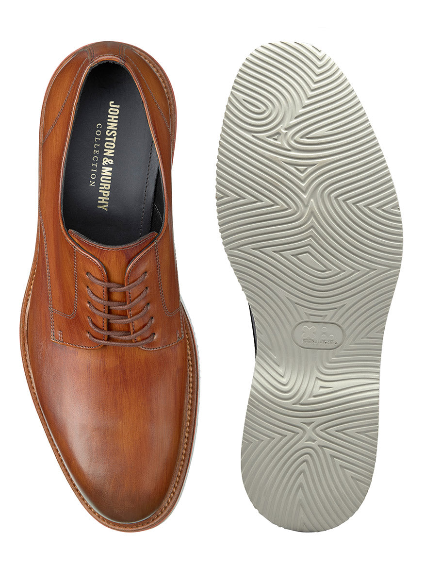A top view of a brown J & M Collection Jenson Plain Toe in Tan Italian Calfskin beside its sole showing the tread pattern.