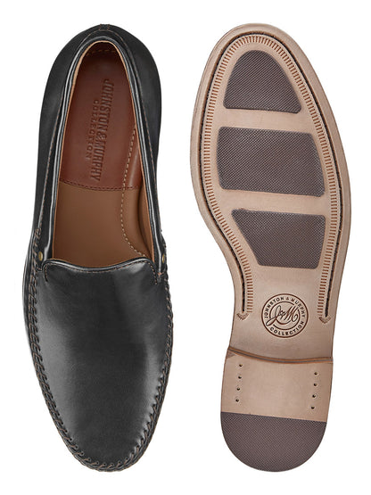 Top and bottom view of the J & M Collection Baldwin Venetian in Black Sheepskin with a brown insole and cushioned footbed. The beige sole features dark gray grip pads, and the brand logo is engraved.