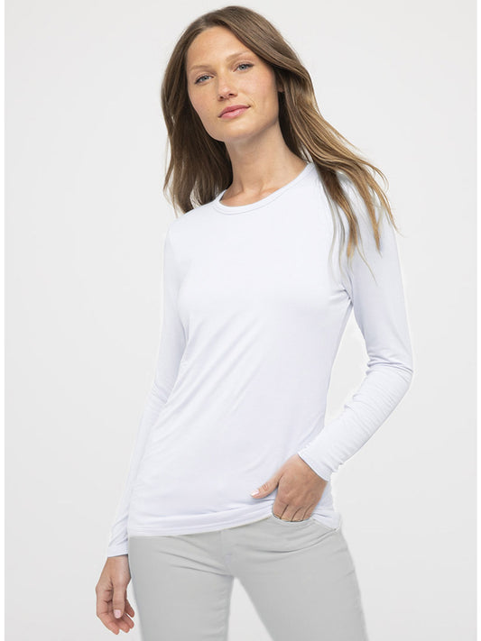 A person with long hair wearing the Kinross Bamboo Long Sleeve Crew Tee in Bianco and light gray pants, standing against a plain white background.