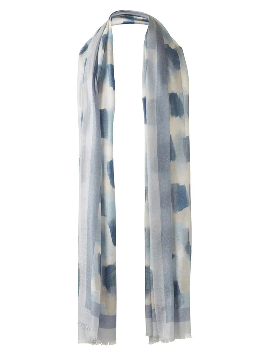 The Kinross Brushstroke Print Scarf in Ink Multi features a lightweight design with a blue and white abstract pattern and raw fringed edges.