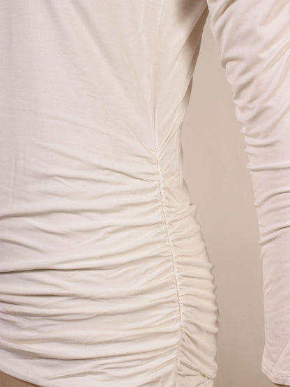 Close-up of the Kinross Ruched Long Sleeve Vee in Bianco, featuring ruched detailing on the side.