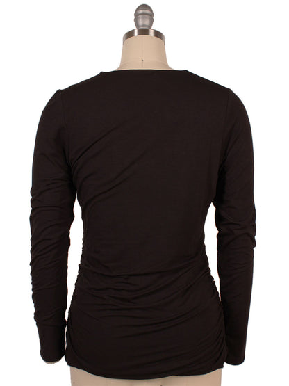 Back view of a mannequin wearing the Kinross Ruched Long Sleeve Vee in Black.
