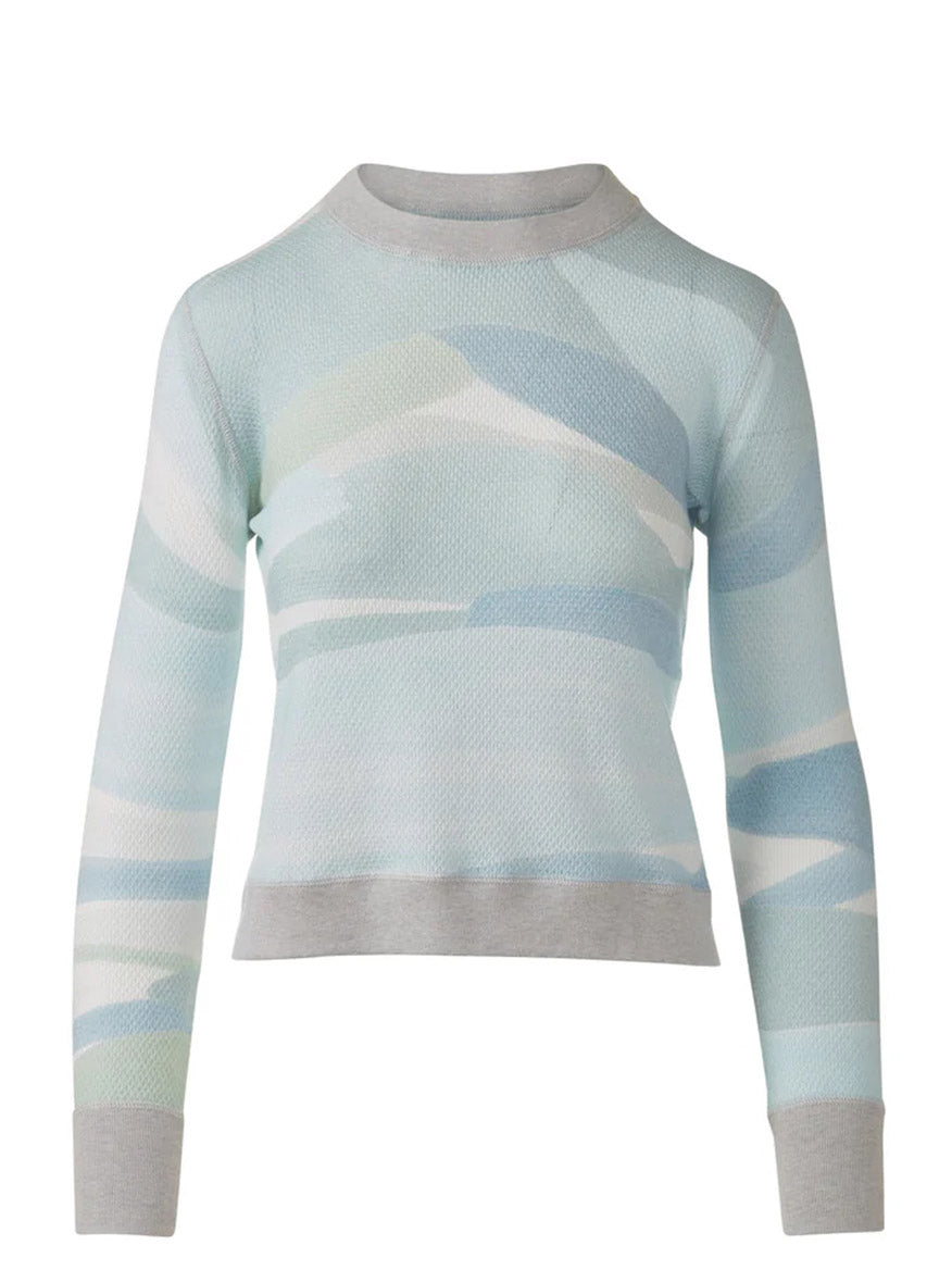 The Kinross Landscape Print Pullover in Multi is a long-sleeve cotton cashmere sweater with a light blue, white, and gray abstract print and gray ribbed cuffs, collar, and hem.