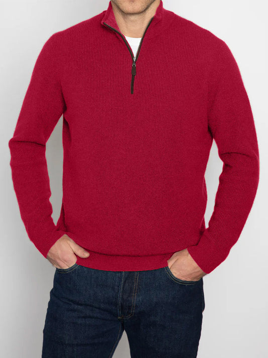 A person wearing the Kinross Suede Trim Rib Quarter Zip Mock Sweater in Crimson and dark jeans stands against a plain background.