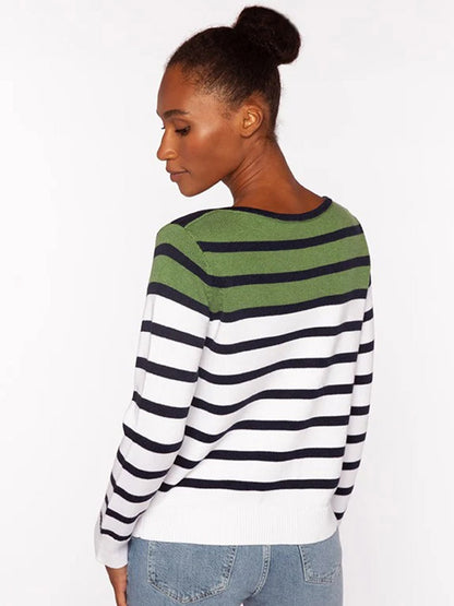 A woman faces away, wearing the Kinross Striped Boatneck in Navy Multi with blue jeans against a plain light background.
