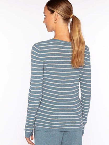 Woman facing away, wearing the Kinross Texture Stripe Crew in Denim/Greystone—blue with white stripes—paired with matching blue pants. Hair is tied back in a low ponytail, capturing a cozy cotton cashmere look from behind.