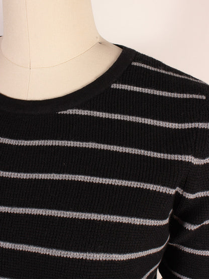 A close-up of a mannequin torso wearing the Kinross Thermal Crew in Black/Granite, showcasing black with granite-grey stripes and a ribbed texture, made from a luxurious Cotton/Cashmere blend.