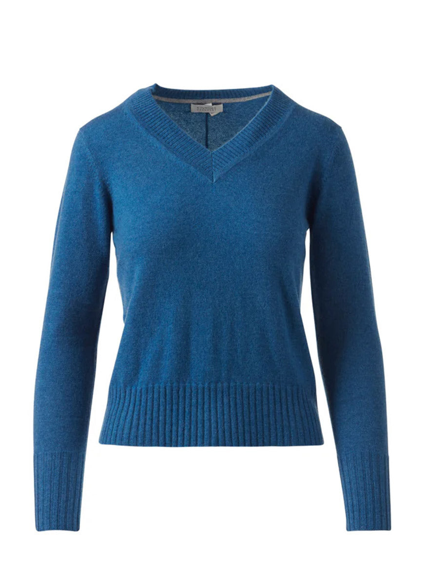 The Kinross Tipped Vee in Sapphire is a blue cashmere V-neck sweater with long sleeves and ribbed cuffs and hem, shown on a white background—luxury knitwear for timeless style.