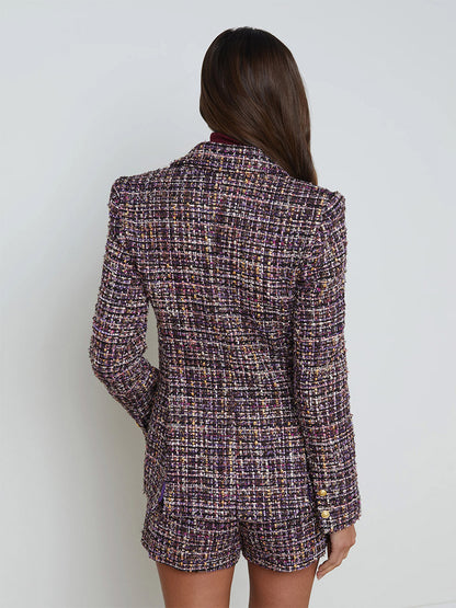 A person with long hair is wearing the L'Agence Chamberlain Tweed Blazer in Purple Multi along with matching shorts, and is facing away from the camera against a plain background.