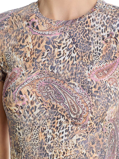 Close-up of a person wearing the L'Agence Ressi Fitted Tee in Valencia Leopard, a slim cut, short-sleeved top with a bestselling leopard paisley print in brown, beige, and pink tones.