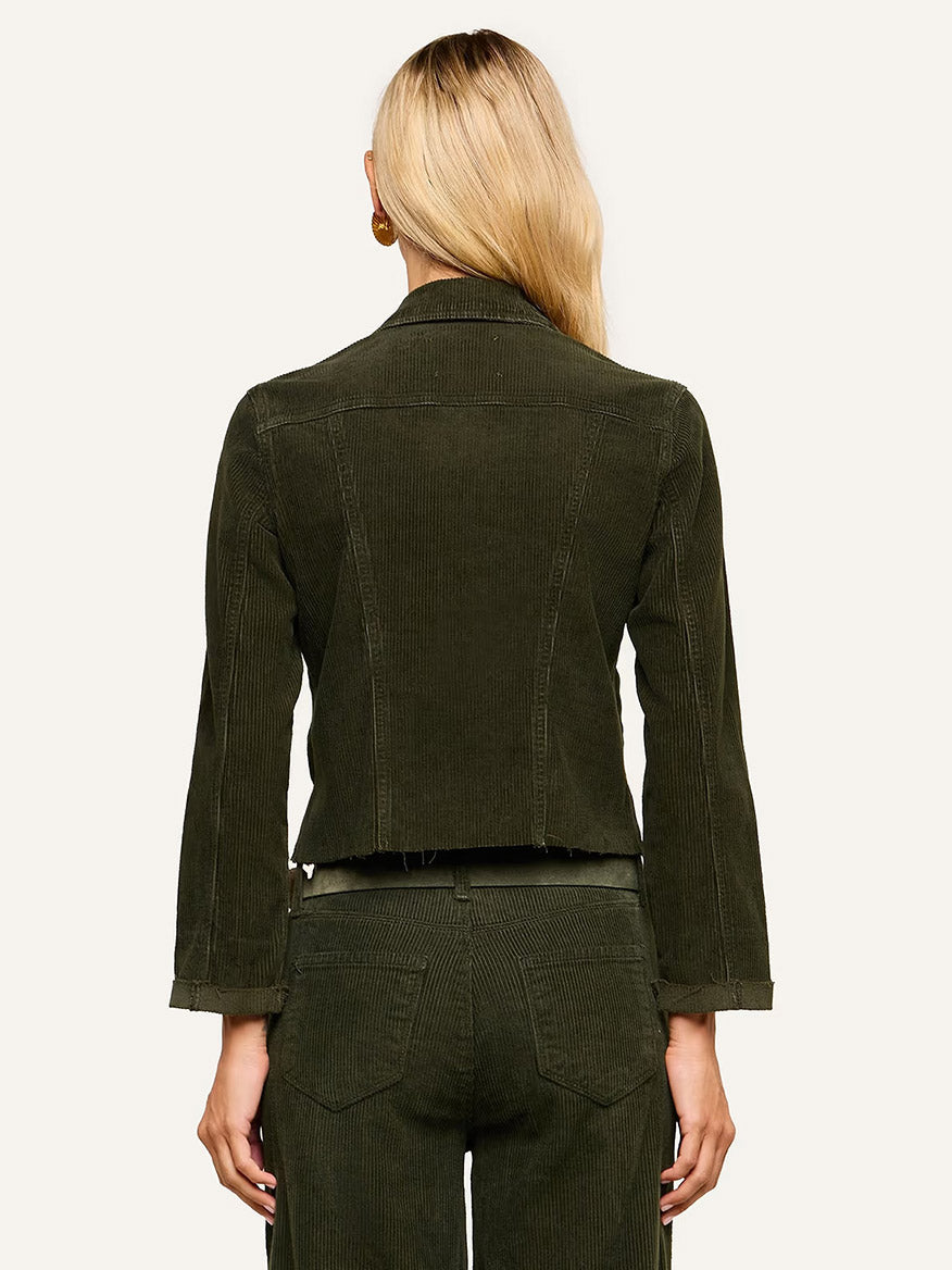 Person with long blonde hair wearing the L’Agence Janelle Corduroy Jacket in Army and matching pants, shown from the back against a plain background.
