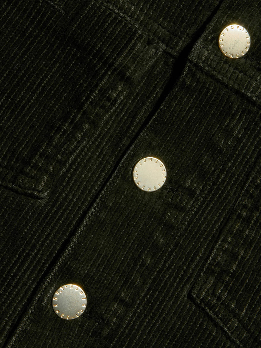 Close-up of the L’Agence Janelle Corduroy Jacket in Army, highlighting the black stretch corduroy fabric with three metallic buttons and its textured vertical ridges—perfect for a slim fit silhouette.