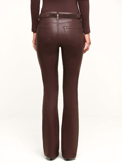 Model wearing the L’Agence Ruth Coated Straight-Leg Jean in Dark Java Coated, paired with a matching brown top, seen from the back against a plain light background.