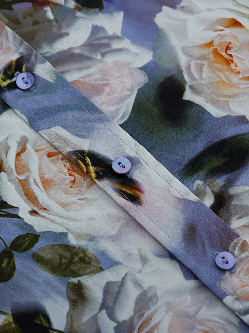 Close-up of the L'Agence Dani Blouse in Multi Distressed Floral, showcasing pastel-colored rose prints and front buttons.