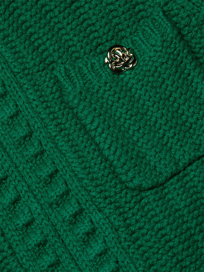 Close-up of the L'Agence Delilah Cropped Cardigan in Kelly Green/Gold Knot, showcasing its textured knit and a pocket with a gold decorative button.