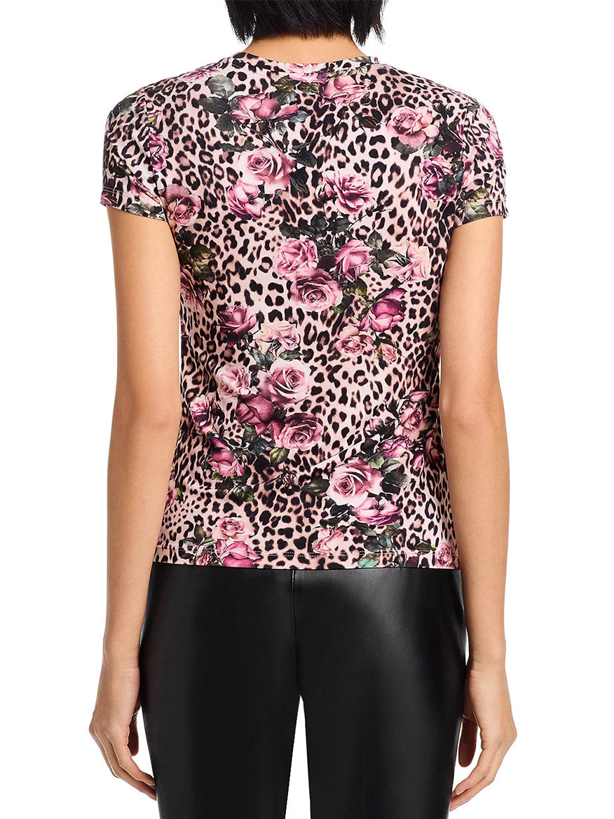 Someone is shown from the back wearing the bestselling L'Agence Ressi Fitted Tee in Multi Rose Cheetah, paired with black pants.