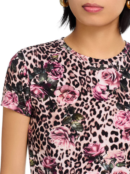 A woman wears the L'Agence Ressi Fitted Tee in Multi Rose Cheetah, a bestselling Los Angeles-made top with a pink and black rose cheetah print and subtle floral accents.