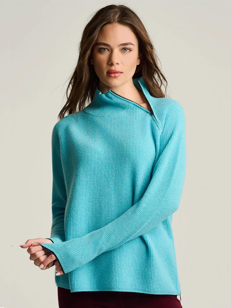 Lisa Todd Double Trouble Cashmere Sweater in Blue Magic, a bright blue knit sweater with rib stitching and an asymmetrical collar zipper.