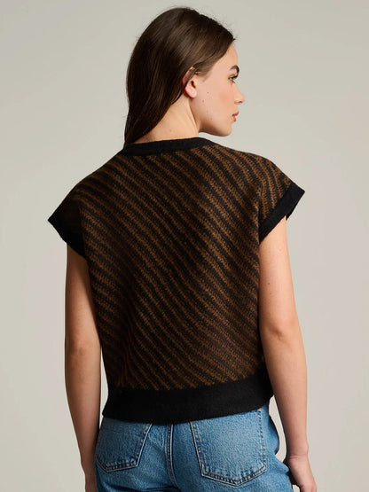 A Lisa Todd In Vest in Black Combo, featuring a sleeveless knit sweater design with a black and brown diagonal striped pattern for modern layering.