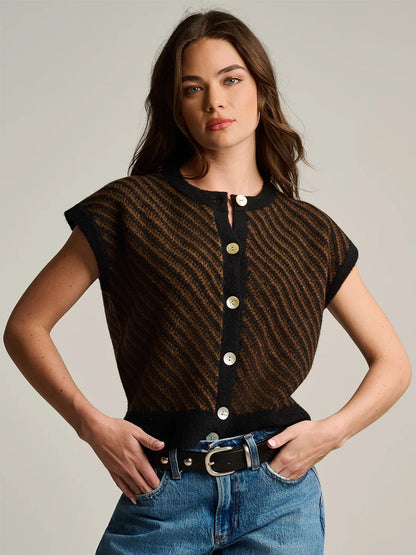 Lisa Todd In Vest in Black Combo, a sleeveless, button-front knit vest featuring a black and brown diagonal wavy pattern, worn with blue jeans.