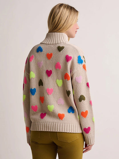 Lisa Todd Love Zip Cardigan in Chickpea: an oversized beige turtleneck zip sweater patterned with multicolored neon hearts.