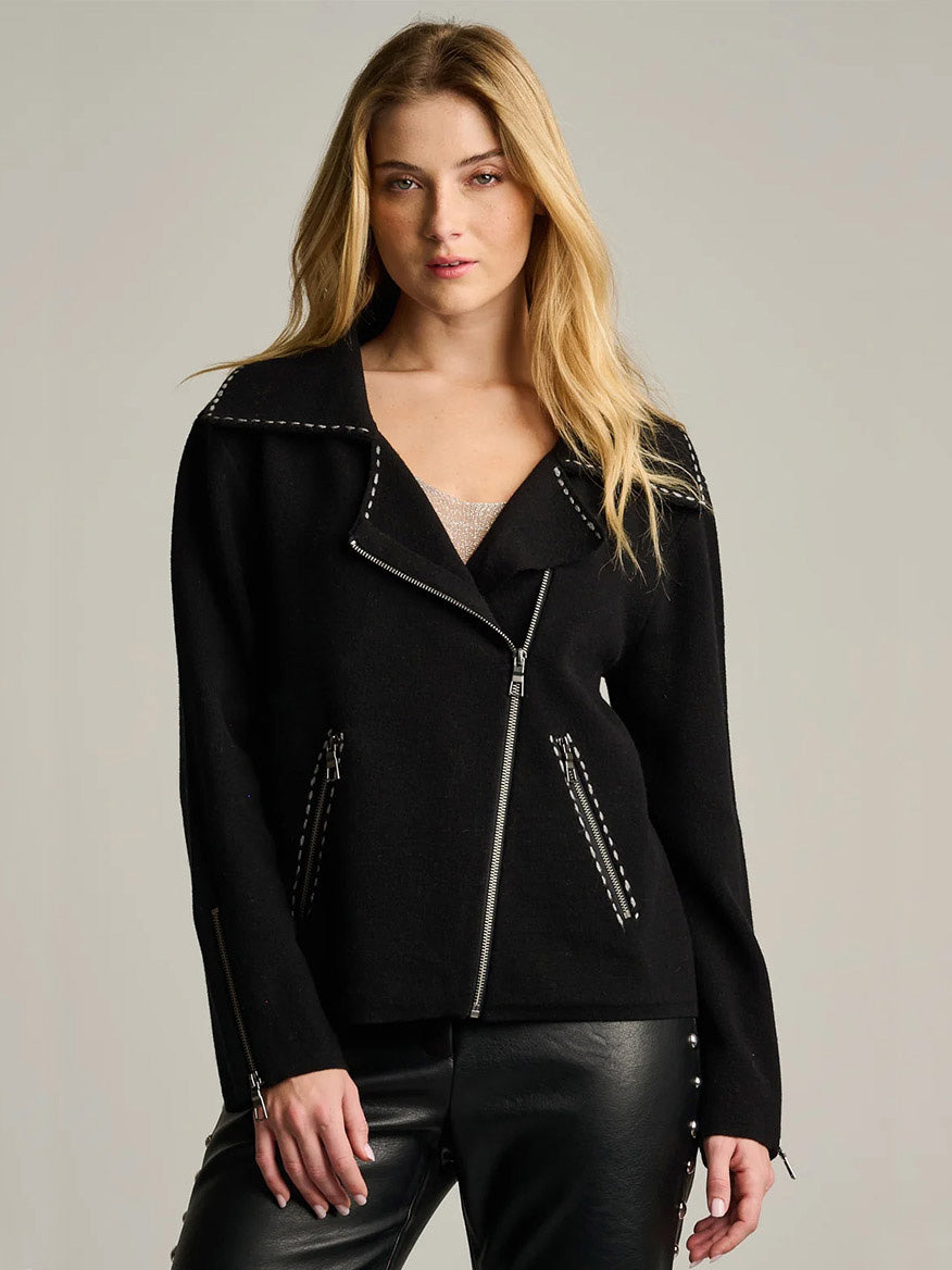 Lisa Todd Moto Stitch Jacket in black with a wide collar, silver zipper hardware, and prominent white whipstitch detailing along the milano stitching seams.