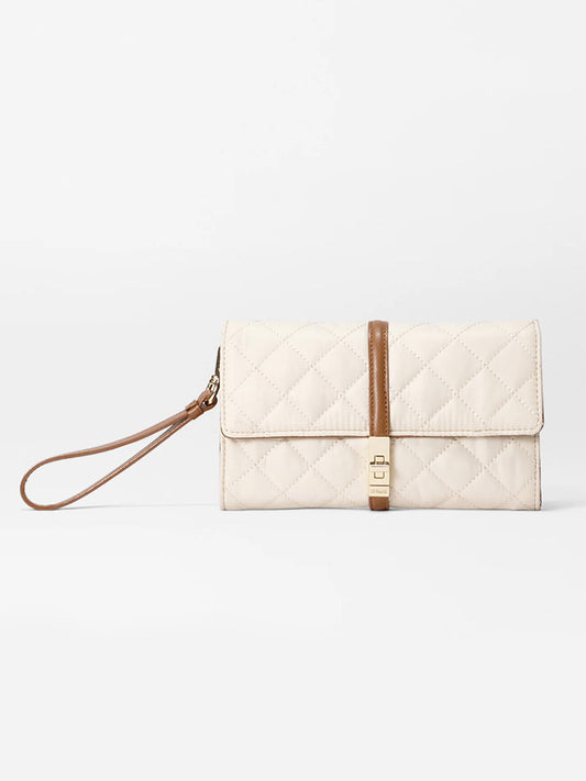 The MZ Wallace Astor Convertible Crossbody in Sandshell Oxford with Brown, from the Astor Collection, features an Italian leather strap and gold clasp, elegantly showcased on a plain white background.