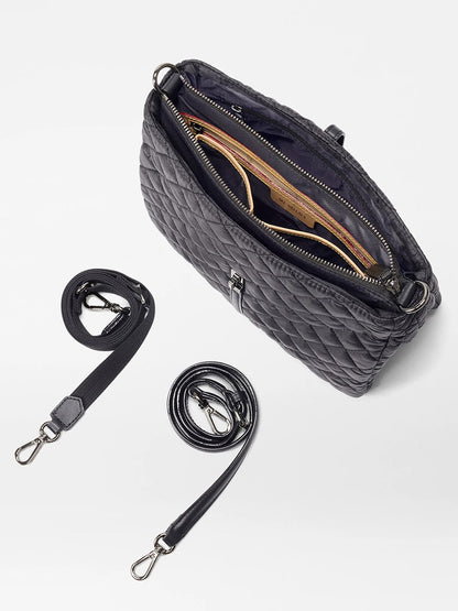 The MZ Wallace Astor Crossbody in Black Oxford is a quilted black bag with two detachable straps, crafted from Italian leather, and features an inner pocket and compartments.