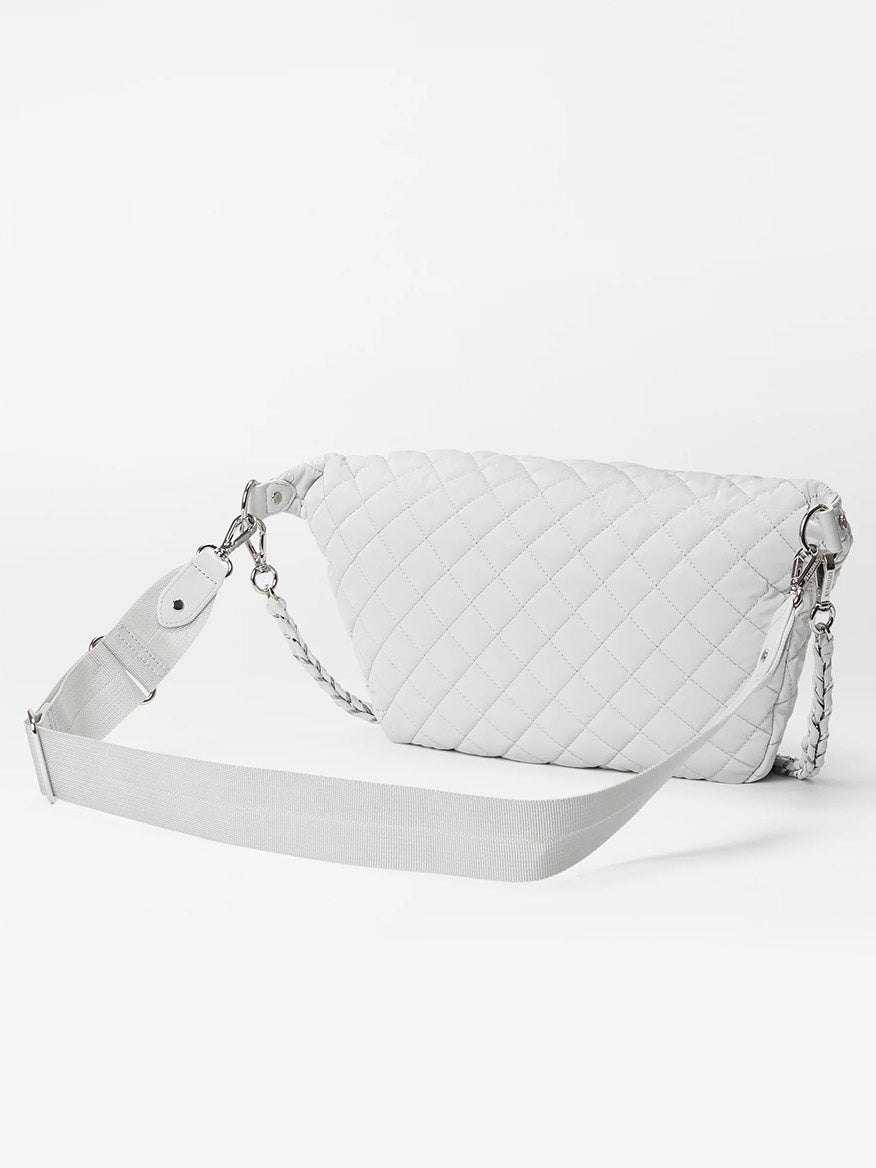 White Italian MZ Wallace Crosby Crossbody Sling Bag in Pebble Liquid with chain detail and adjustable strap against a white background.