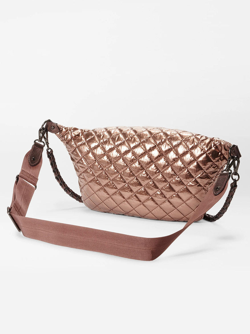 The MZ Wallace Crosby Crossbody Sling Bag in Copper Metallic Lacquer Oxford is a quilted metallic crossbody sling bag with dark metal hardware, featuring Italian leather trim and a wide adjustable strap for a stylish hands-free option.