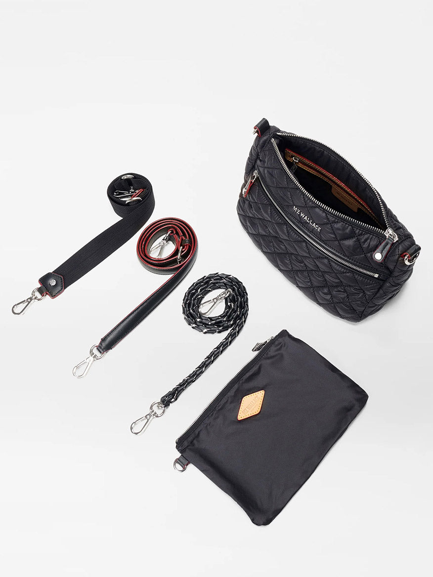 MZ Wallace Crosby Ella Crossbody in Black Oxford featuring Italian leather with a quilted design, a zippered pouch, two detachable straps, and a braided handle, beautifully displayed on a white surface.