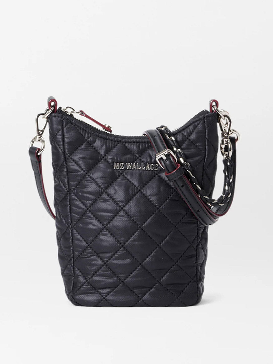 A MZ Wallace Crosby Go in Black Oxford tote with quilted fabric, a red zipper detail, and a brand label.