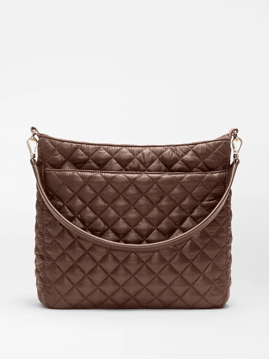 The MZ Wallace Crosby Hobo in Walnut Oxford, crafted from recycled nylon with sophisticated Italian leather trim, is displayed against a plain light background. This brown quilted shoulder bag features a detachable strap for versatile styling options.